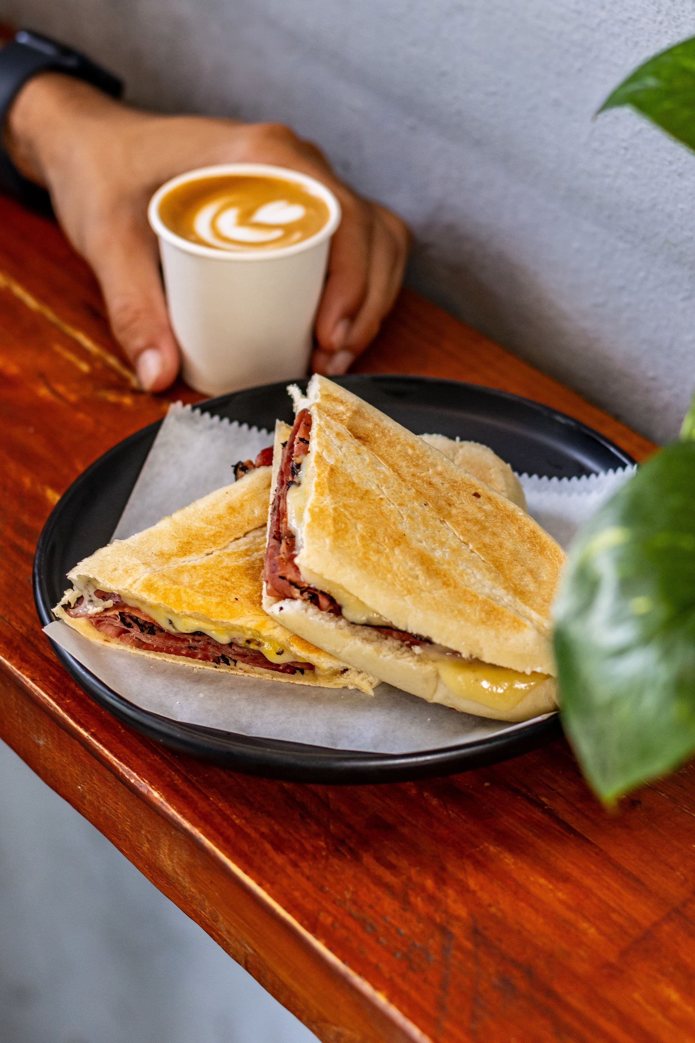 Breakfast sandwich and latte at La Puya Café